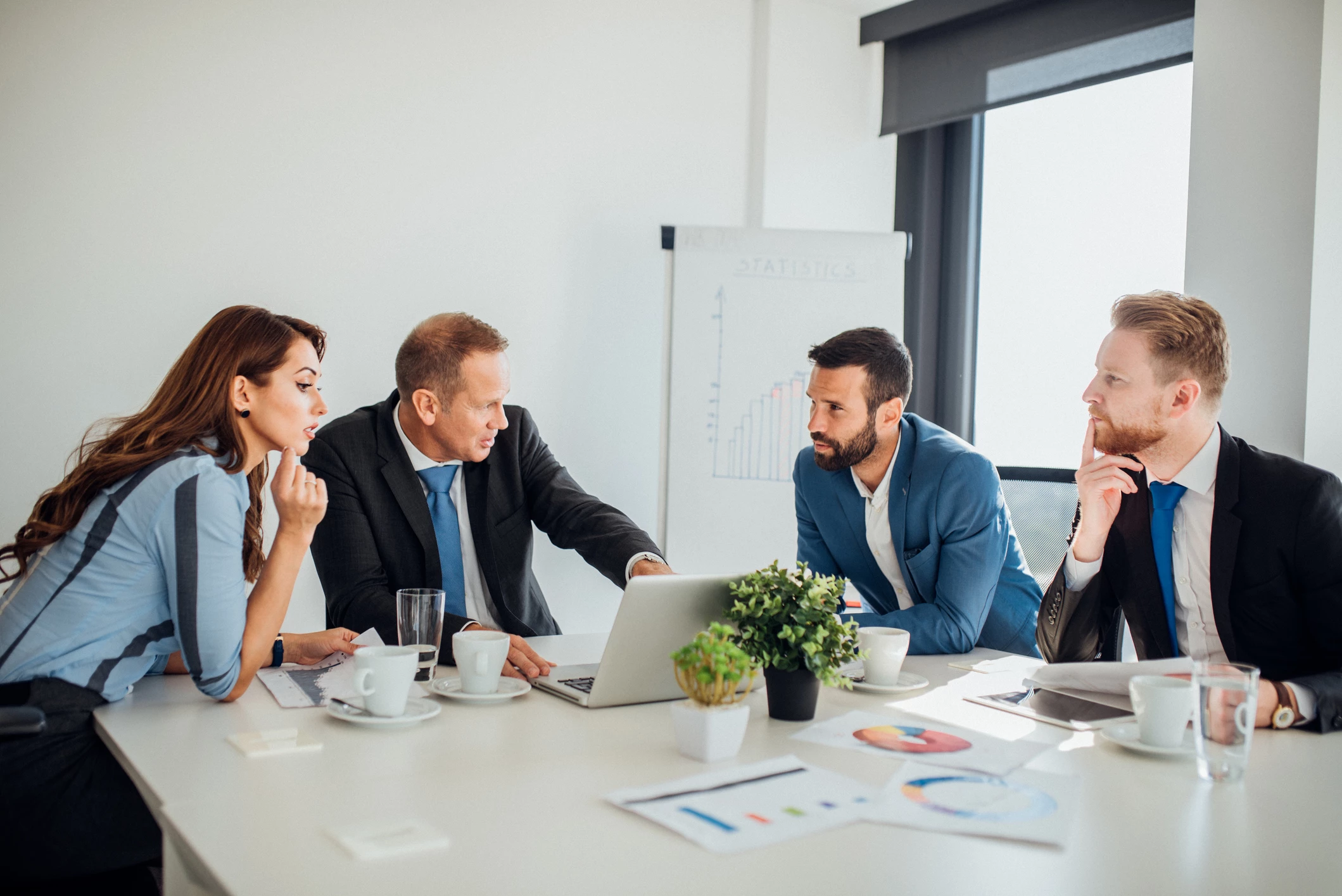 coworkers-having-business-meeting-1065375896-2123x1417